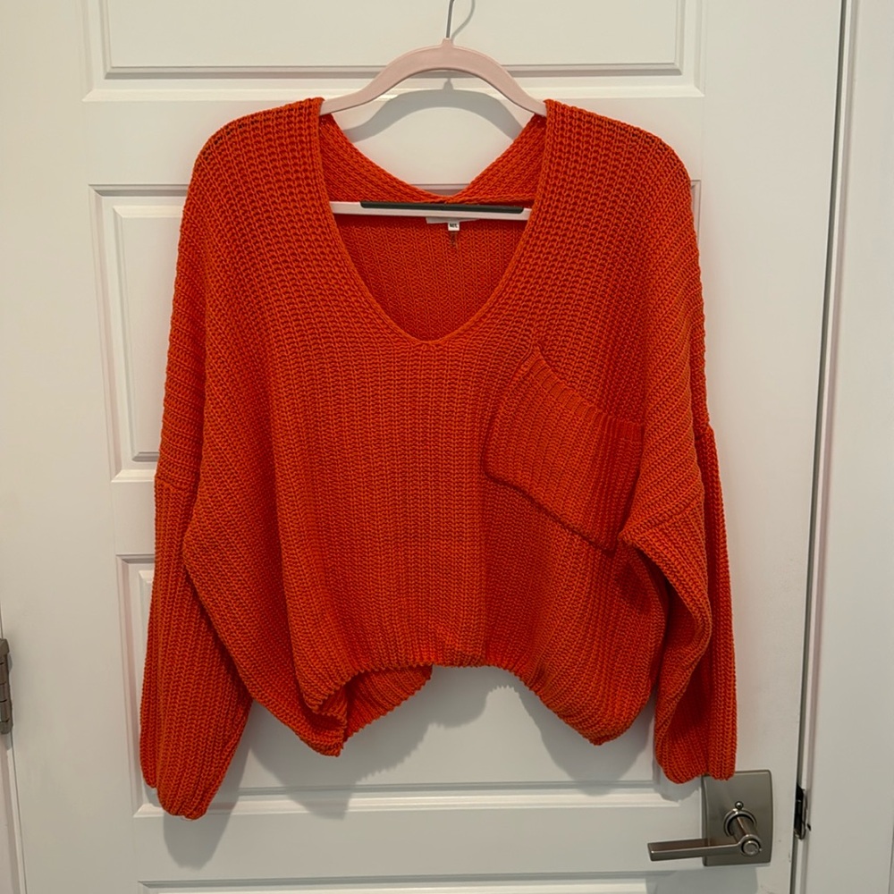 Orange knit sweater